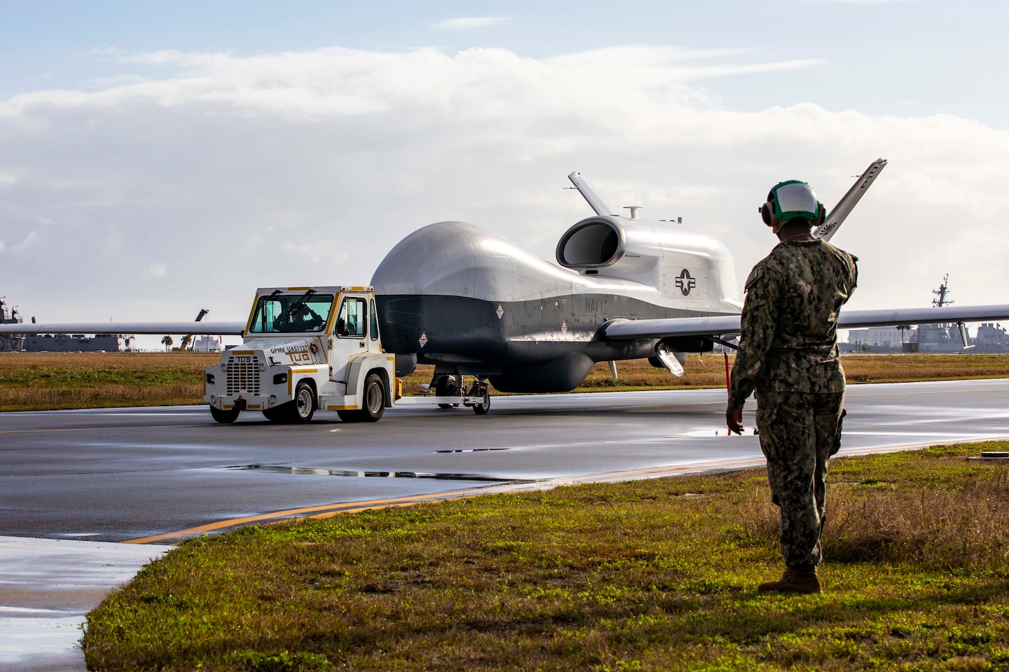 An MQ-4C Triton Unmanned Aircraft System (UAS), assigned to Unmanned Patrol Squadron 19 (VUP-19), taxis across the flight line