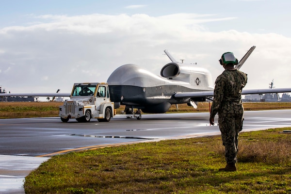 An MQ-4C Triton Unmanned Aircraft System (UAS), assigned to Unmanned Patrol Squadron 19 (VUP-19), taxis across the flight line at Naval Station Mayport, Fla.