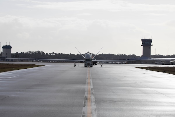 An MQ-4C Triton Unmanned Aircraft System (UAS), assigned to Unmanned Patrol Squadron 19 (VUP-19), taxis across the flight line at Naval Station Mayport, Fla.