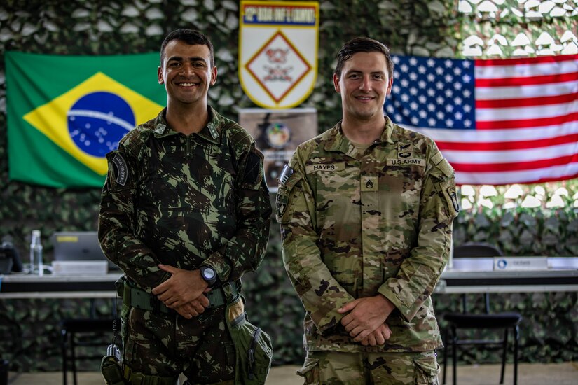 U.S. Army Soldier Staff Sgt. Shane Hayes, weapons squad leader with Bulldog Company, 1st Battalion, 187th Infantry Regiment, 3rd Brigade Combat Team, 101st Airborne Division (Air Assault) stands with his weapon during Exercise Southern Vanguard 22 in Resende, Brazil, Dec. 11, 2021. U.S. and Brazilian Army soldiers took part in the air assault exercise, which was the largest deployment of a U.S Army unit to train with the Brazilian Army forces in Brazil. (U.S Army photo by Pfc. Joshua Taeckens)