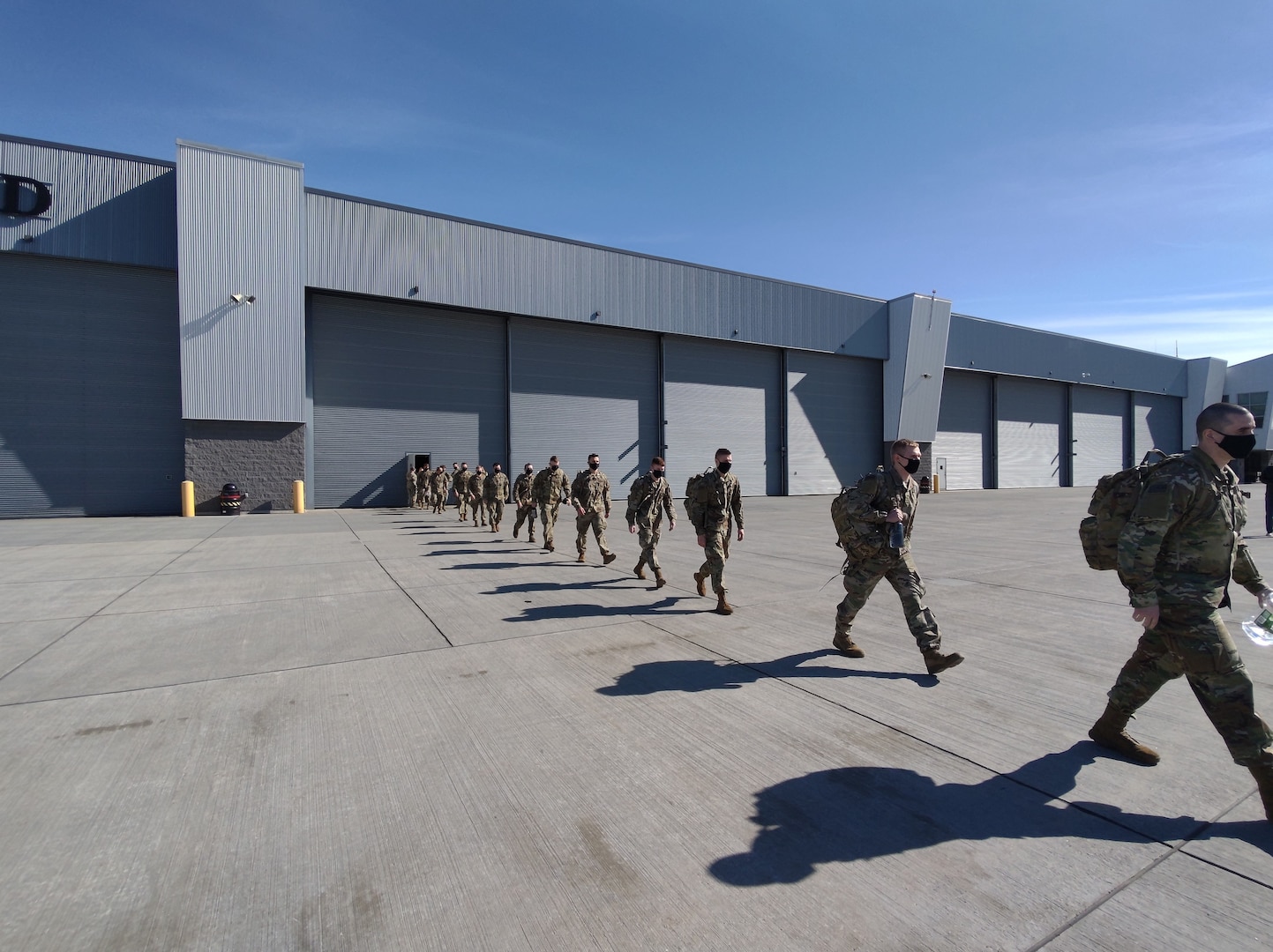 Members of Charlie Troop, 1st Squadron, 172nd Cavalry (Mountain) and Bravo Company, 572nd Brigade Engineer Battalion (Mountain), Vermont Army National Guard, begin to load onto their flight at the Army Aviation Support Facility, South Burlington, Vermont, March 10, 2021. In total, over 100 soldiers comprise these deployments to U.S. Africa Command to conduct area security support operations. (U.S. National Guard photo by Joshua Cohen)