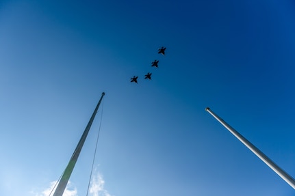 Four F-35A Lightning IIs assigned to the 158th Fighter Wing, Vermont Air National Guard, fly in formation over September drill's 9/11 remembrance ceremony at the wing’s flagpole, Vermont Air National Guard base, South Burlington, Vermont, Sept. 11, 2021. Known as 9/11, this year marks the 20th anniversary of the coordinated terrorist attacks on the morning of Sept. 11, 2001. (U.S. Air National Guard photo by Julie M. Paroline)