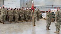 Capt. Jacob Girard, commander, Bravo Battery, 101st Field Artillery Regiment (right), takes command of the formation from 1st Sgt. Seth Wilkerson, first sergeant, during a sendoff ceremony for the unit at Waterbury Armory in Waterbury, Vermont, March 29, 2021. The Vermont National Guard is being activated on federal orders and deployed to support overseas operations. (U.S. Army National Guard photo by Don Branum)