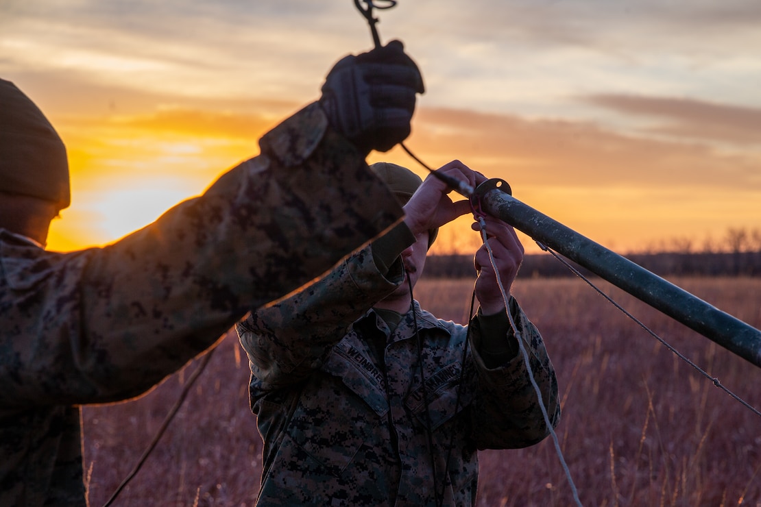 U.S. Marines with 2d Marine Regiment, 2d Marine Division (MARDIV), set up an antenna during the 2d MARDIV High-Frequency (HF) Competition at Fort Sill, Okla., Dec. 6, 2021. The competition enhanced HF transmission proficiency and capabilities to prepare Marines for future expeditionary conflicts where areas may be either contested or degraded. (U.S. Marine Corps photo by Cpl. Elijah J. Abernathy)