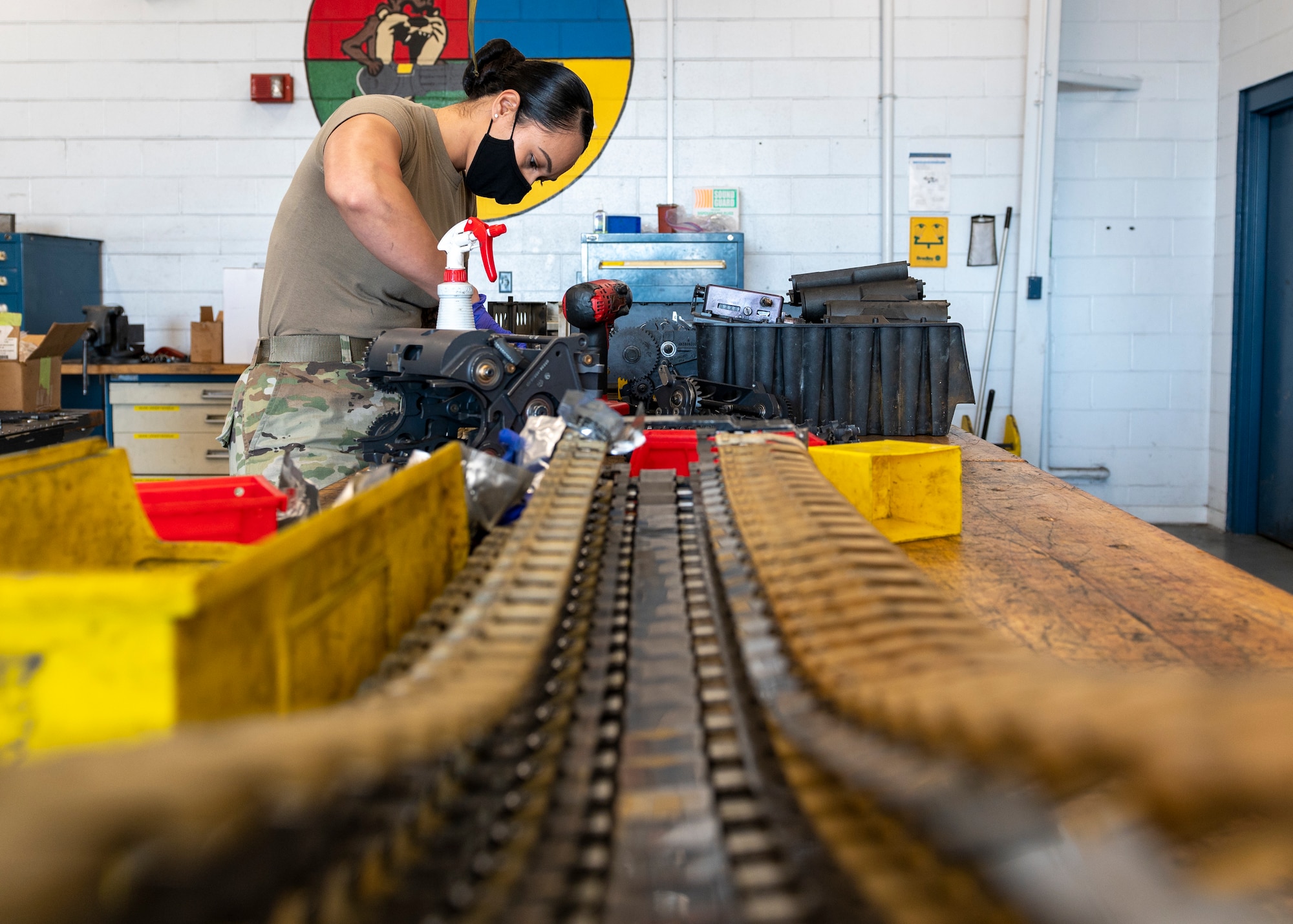 Staff Sgt. Dora Pulu, 4th Equipment Maintenance Squadron armament maintenance supervisor, cleans components of a 20 mm gun at Seymour Johnson Air Force Base, North Carolina, Nov. 17, 2021.