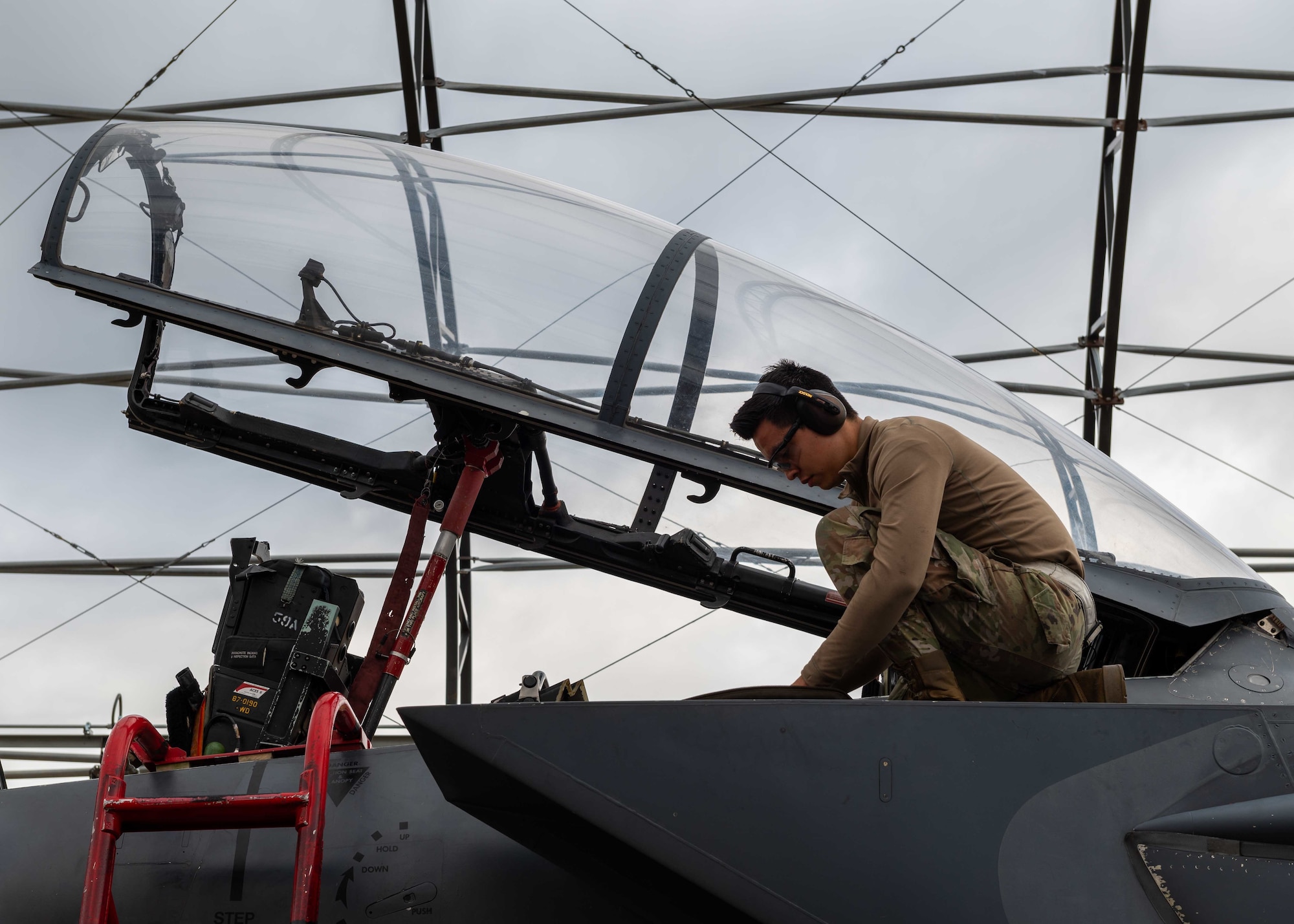 Airman 1st Class Kevin Esparza, 4th Equipment Maintenance Squadron aircraft structural maintenance technician, removes and replaces a metal plate on an F-15E Strike Eagle at Seymour Johnson Air Force Base, North Carolina, Nov. 2, 2021.