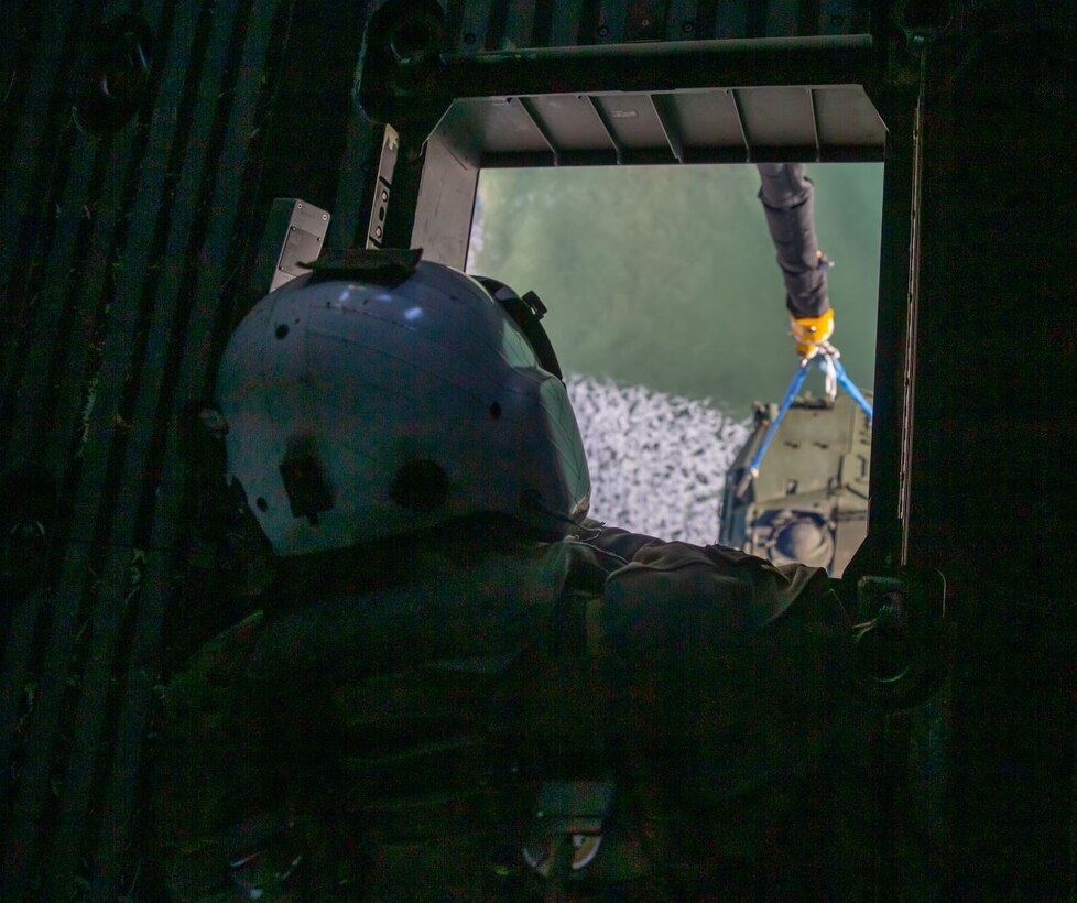 U.S. Marines with Marine Operational Test and Evaluation Squadron One (VMX-1) test the capabilities of the CH-53K King Stallion on Marine Corps Base Camp Lejeune, Dec. 16, 2021. Personnel with VMX-1 conducted surge flight operations to test the external lift capability of the CH-53K in support of amphibious operations. It can externally transport 27,000 lbs. over 110 nautical miles and has a max external lift of 36,000 lbs., three times that of the legacy "E" aircraft. The CH-53K King Stallion is a heavy-lift cargo helicopter currently being produced and tested to replace the CH-53E Super Stallion. (U.S. Marine Corps photo by Lance Cpl. Samuel Lyden)