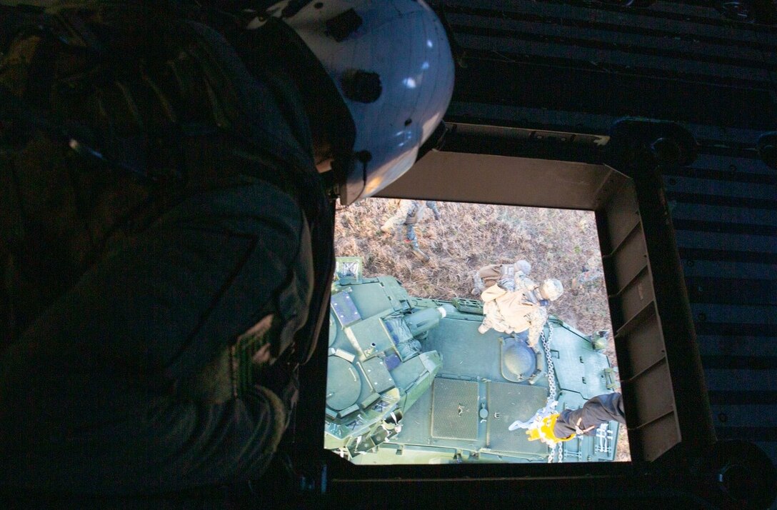 U.S. Marines with Marine Operational Test and Evaluation Squadron One (VMX-1) test the capabilities of the CH-53K King Stallion on Marine Corps Base Camp Lejeune, Dec. 16, 2021. Personnel with VMX-1 conducted surge flight operations to test the external lift capability of the CH-53K in support of amphibious operations. It can externally transport 27,000 lbs. over 110 nautical miles and has a max external lift of 36,000 lbs., three times that of the legacy "E" aircraft. The CH-53K King Stallion is a heavy-lift cargo helicopter currently being produced and tested to replace the CH-53E Super Stallion. (U.S. Marine Corps photo by Lance Cpl. Samuel Lyden)