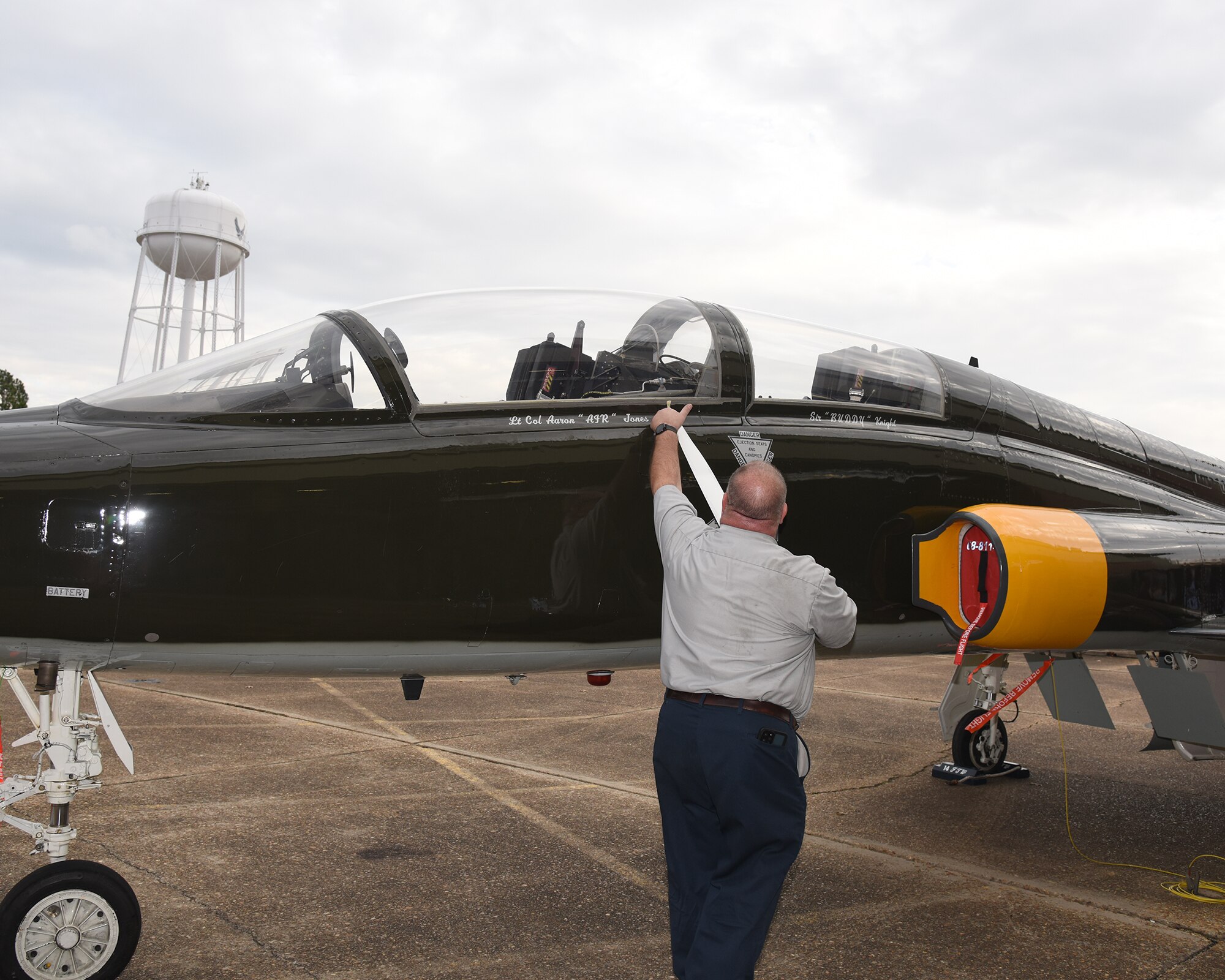 The 49th Fighter Training Squadron T-38 Talon heritage flagship gets the commander name changed Dec. 16, 2021, on Columbus Air Force Base, Miss. Squadron Flagships are named after the current commander and are revealed during Change of Command ceremonies. (U.S. Air Force photo by Elizabeth Owens)