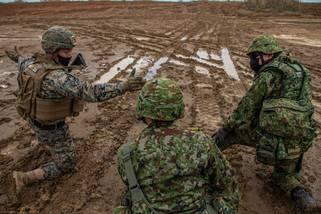 U.S. Marines and soldiers with the Japan Ground Self-Defense Force prepare to receive an aerial resupply during Resolute Dragon 21, on Ojojihara Proving Grounds, Dec. 10, 2021. RD21 is the largest bilateral field training exercise between the U.S. Marine Corps and JGSDF since 2013 and is the largest ever in Japan. RD21 is designed to strengthen the defensive capabilities of the U.S.-Japan Alliance by exercising integrated command and control, targeting, combined arms, and maneuver across multiple domains.