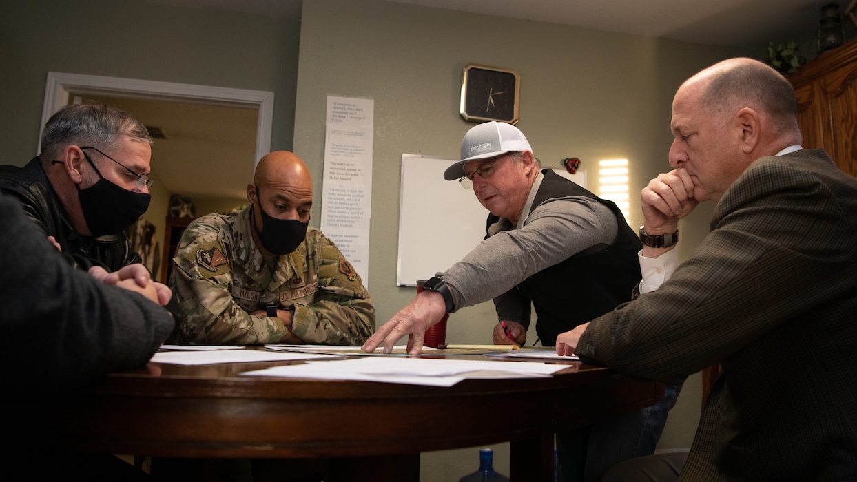 U.S. Air Force Col. Terence Taylor, 27th Special Operations Wing commander, Rick Masters, 27 SOW director of staff, Art Schaap, Highland Dairy owner, and John Kern, Clean Water Partnership Cannon executive director, discuss PFAS remedial investigation and cleanup efforts Dec. 13, 2021, at the Highland Dairy in Clovis, New Mexico. Col. Taylor and other senior officials visited Schaap’s dairy in order to learn more about how contaminated water impacted surrounding agricultural facilities. The Air Force Civil Engineer Center is utilizing various avenues of investigations, interagency collaboration, and direct community feedback in order to best address PFAS environmental issues surrounding Cannon AFB.