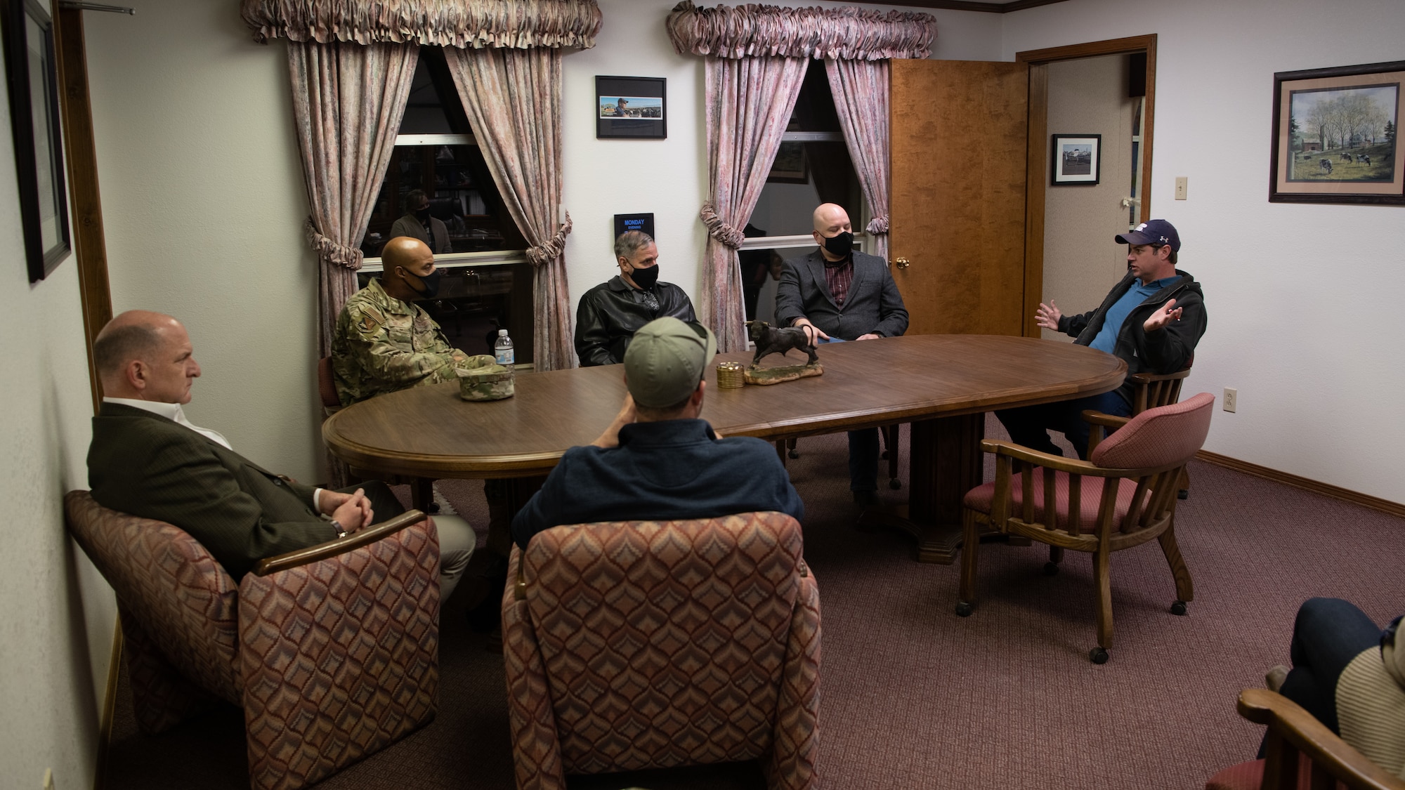 Leaders from the 27th Special Operations Wing, Air Force Civil Engineer Center, and Clean Water Partnership Cannon discuss ongoing PFAS remedial investigation and mitigation efforts with Rajen Dairy owners, Dec. 13, 2021, at Rajen Dairy in Clovis, New Mexico. Officials from Cannon Air Force Base visited Rajen Dairy in order to learn more about how PFAS water contamination impacted adjacent agricultural facilities. In addition to ongoing AFCEC remedial investigation efforts, wing leaders continue to engage with community members to better understand big-picture PFAS environmental issues.