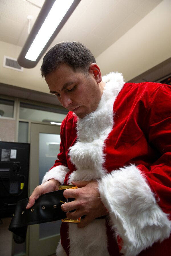 U.S. Marine Corps Staff Sgt. Federico Gomez, the motor transportation chief with Delta Company, 4th Law Enforcement Battalion, Marine Forces Reserve, dresses as Santa Claus before handing gifts to the students of Shungnak School in Shungnak, Alaska, Dec. 8, 2021. The “Alaska Marines” went to Alaska’s Northwest Arctic Borough and traveled by snowmobile and aircraft to dress as Santa Claus and deliver toys to children in remote villages belonging to Alaskan Natives in support of the Marine Forces Reserve Toys for Tots program. (U.S. Marine Corps photo by Cpl. Brendan Mullin)