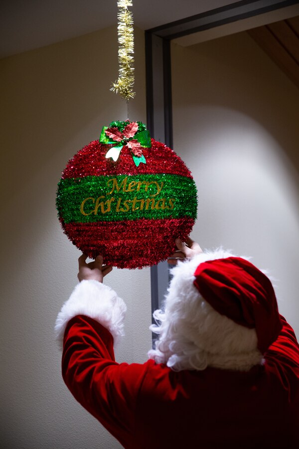 U.S. Marine Corps Gunnery Sgt. Jake Paolucci, Company Gunnery Sgt. of Delta Company, 4th Law Enforcement Battalion, Marine Forces Reserve, poses for a photo while dressed as Santa Claus in Kotzebue, Alaska, Dec. 11, 2021. The Marine Corps Reserve hosts the Toys for Tots program, collects donations of toys, and delivers them to school-aged children across the United States. (U.S. Marine Corps photo by Cpl. Brendan Mullin)