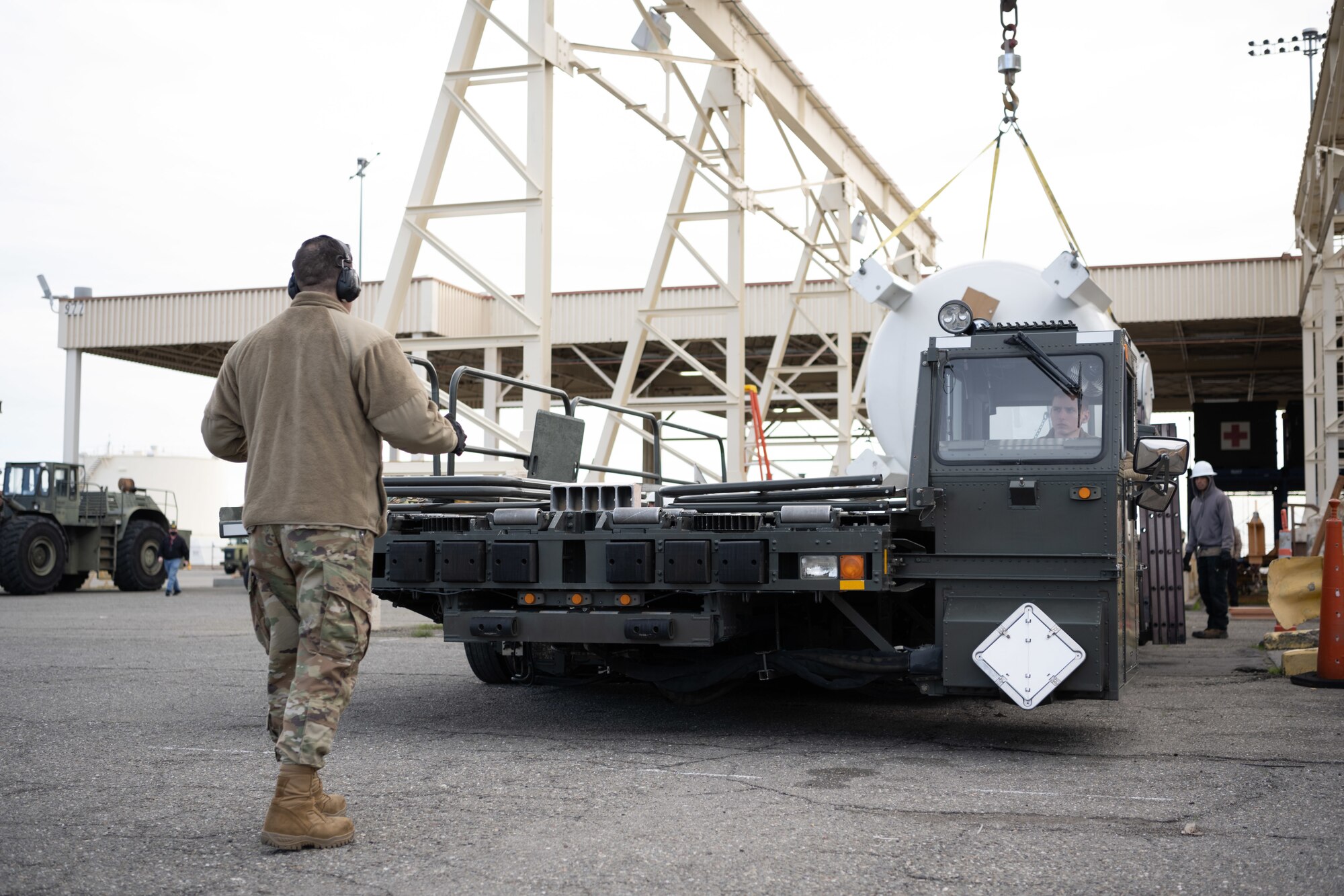 Photos of U.S. Airmen providing support to move modular carbon adsorption systems for JBPHH.