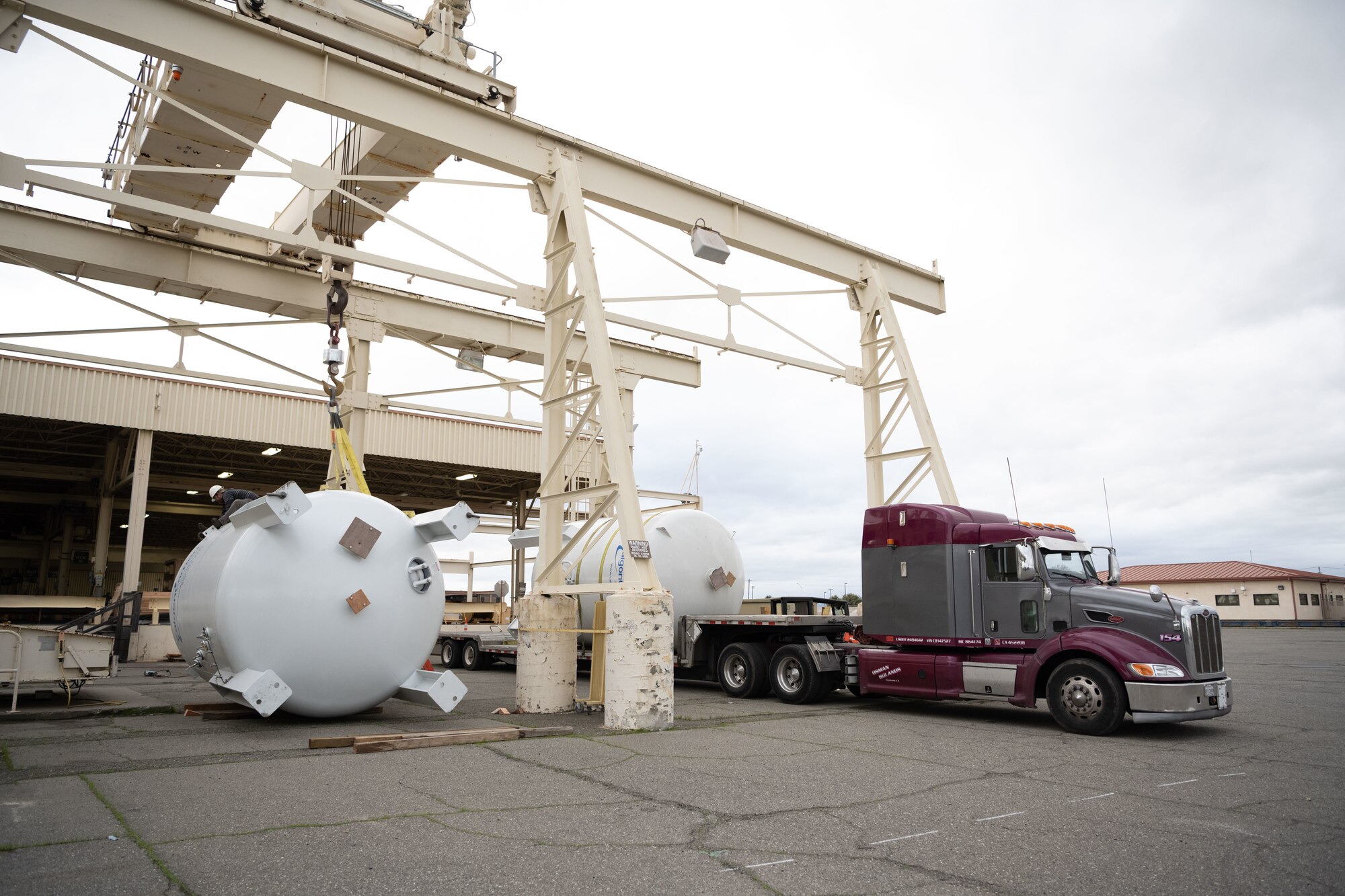 Photos of U.S. Airmen providing support to move modular carbon adsorption systems for JBPHH.