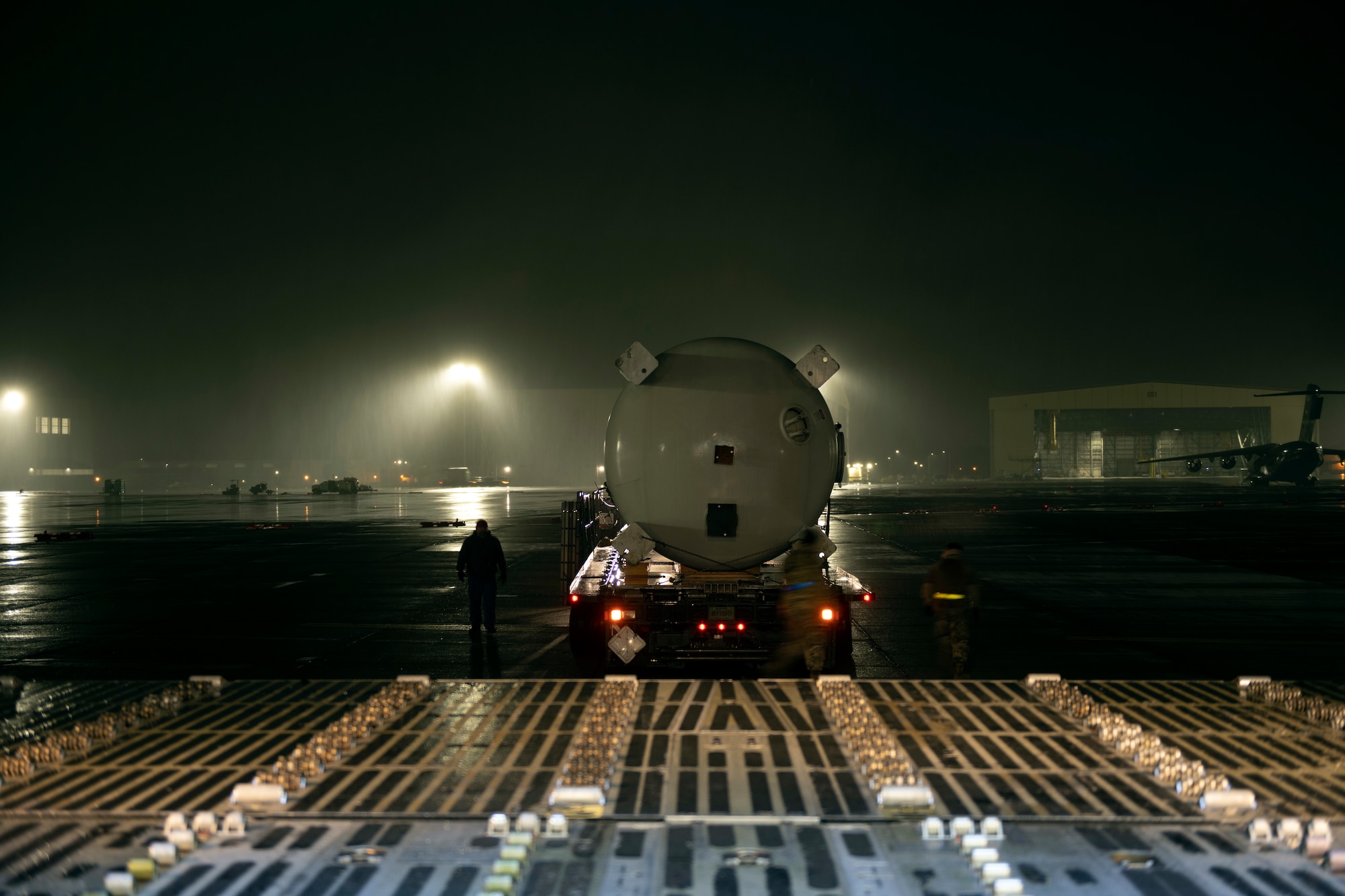 Photos of U.S. Airmen providing support to move modular carbon adsorption systems for JBPHH.