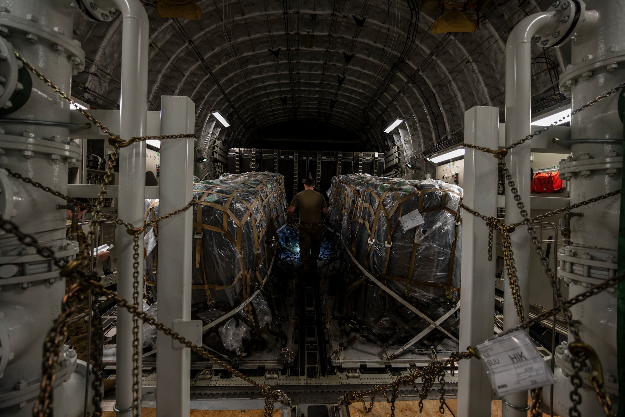 Photos of U.S. Airmen providing support to move modular carbon adsorption systems for JBPHH.