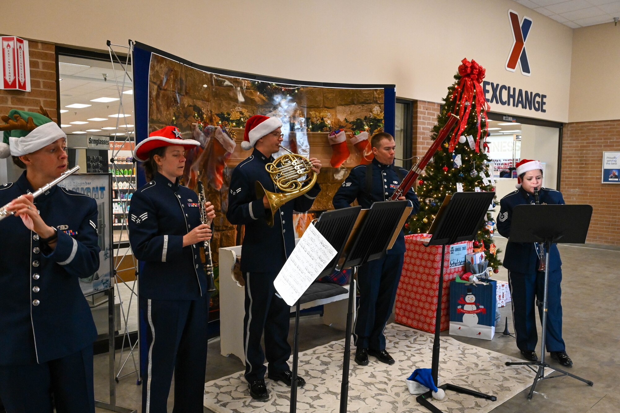 The U.S. Air Force Band of the West performs at the Base Exchange at Altus Air Force Base, Oklahoma, Dec. 14, 2021. The USAF Band of the West travels more than 125,000 miles annually and provides hundreds of performances to military and civilian audiences throughout Texas, Oklahoma, Louisiana, Mississippi, Alabama, Georgia, Florida, and Puerto Rico. (U.S. Air Force photo by Airman 1st Class Kayla Christenson)