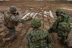 U.S. Marines and soldiers with the Japan Ground Self-Defense Force (JGSDF) prepare to receive an aerial resupply during Resolute Dragon 21, on Ojojihara Proving Grounds, Dec. 10, 2021. RD21 is the largest bilateral field training exercise between the U.S. Marine Corps and JGSDF since 2013 and is the largest ever in Japan. RD21 is designed to strengthen the defensive capabilities of the U.S.-Japan Alliance by exercising integrated command and control, targeting, combined arms, and maneuver across multiple domains.