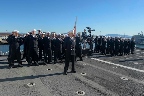 SAN DIEGO (Dec 17, 2021) Sailors assigned to Independence-variant littoral combat ship USS Kansas City (LCS 22) stand in formation during a commissioning commemoration ceremony on the flight deck. The Navy commissioned LCS 22, the second ship in naval history to be named Kansas City, via naval message due to public health safety and restrictions of large public events related to the novel coronavirus (COVID-19) pandemic. Kansas City is homeported at Naval Base San Diego. (U.S. Navy photo by Mass Communication Specialist 2nd Class Vance Hand/Released)