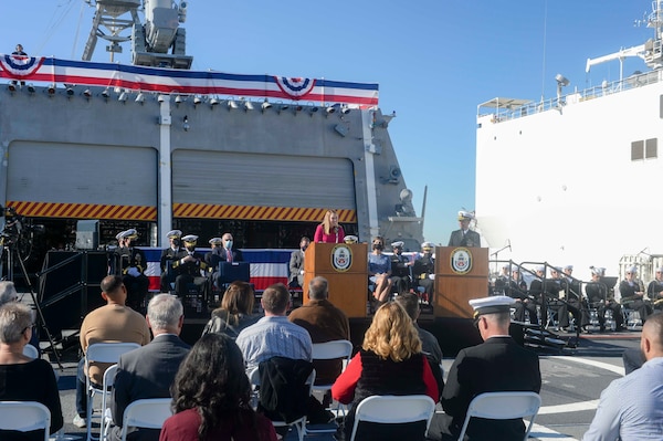 SAN DIEGO (Dec 17, 2021) Meredith Berger, performing the duties of the Under Secretary of the Navy, delivers remarks to the Sailors and guests onboard Independence-variant littoral combat ship USS Kansas City (LCS 22) during a commissioning commemoration ceremony on the flight deck. The Navy commissioned LCS 22, the second ship in naval history to be named Kansas City, via naval message due to public health safety and restrictions of large public events related to the novel coronavirus (COVID-19) pandemic. Kansas City is homeported at Naval Base San Diego. (U.S. Navy photo by Mass Communication Specialist 2nd Class Vance Hand/Released)