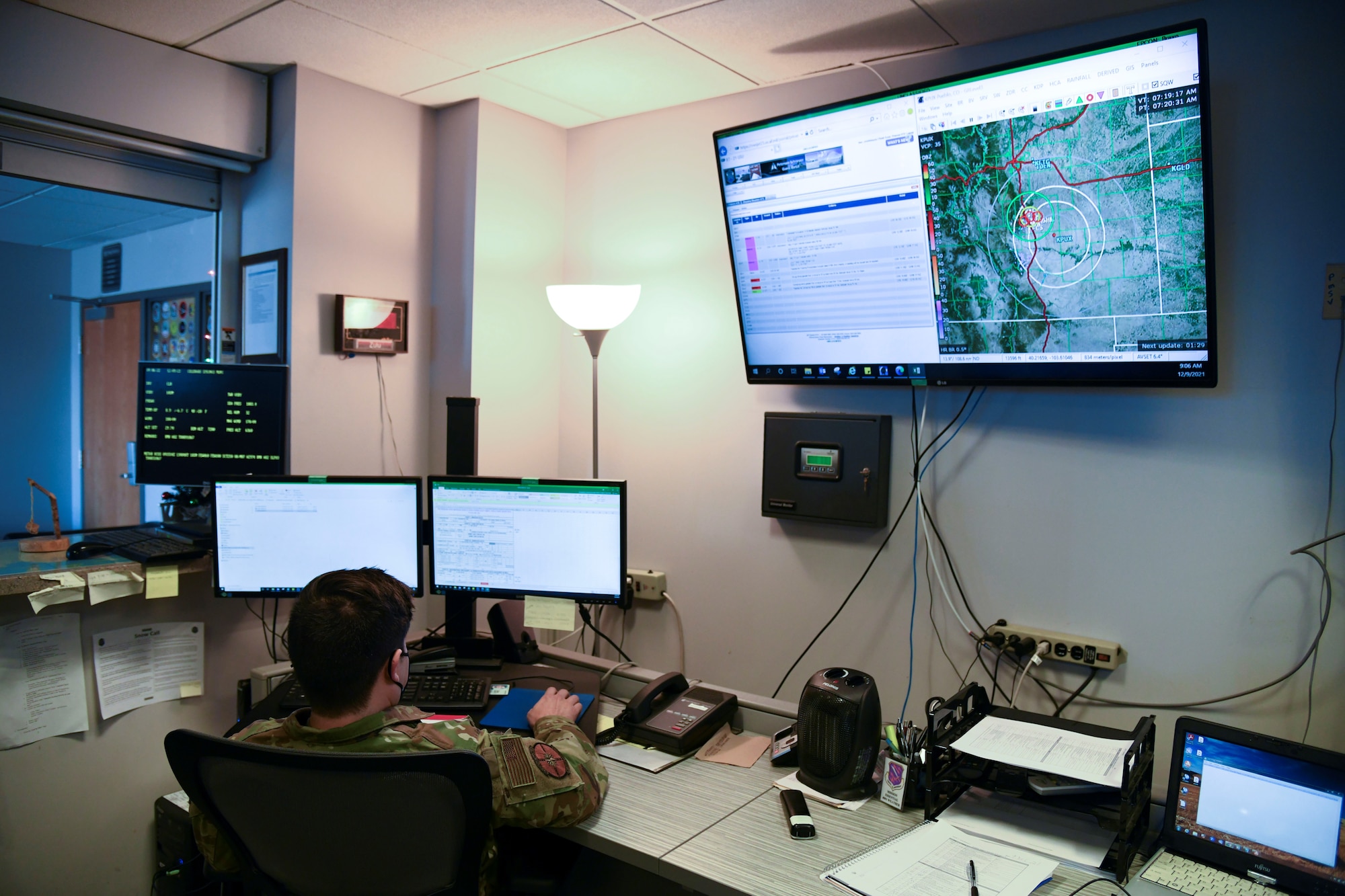 U.S. Air Force Senior Airman John Velasquez, 21st Logistics Readiness Squadron weather flight weather forecaster, checks radar imagery for future weather events at Peterson Space Force Base, Colorado, Dec. 9, 2021. Terrestrial weather, or weather on Earth, like rain, snow and dense cloud cover can disrupt and block signals traveling between satellites and ground stations, making it difficult to control space assets and gather information.