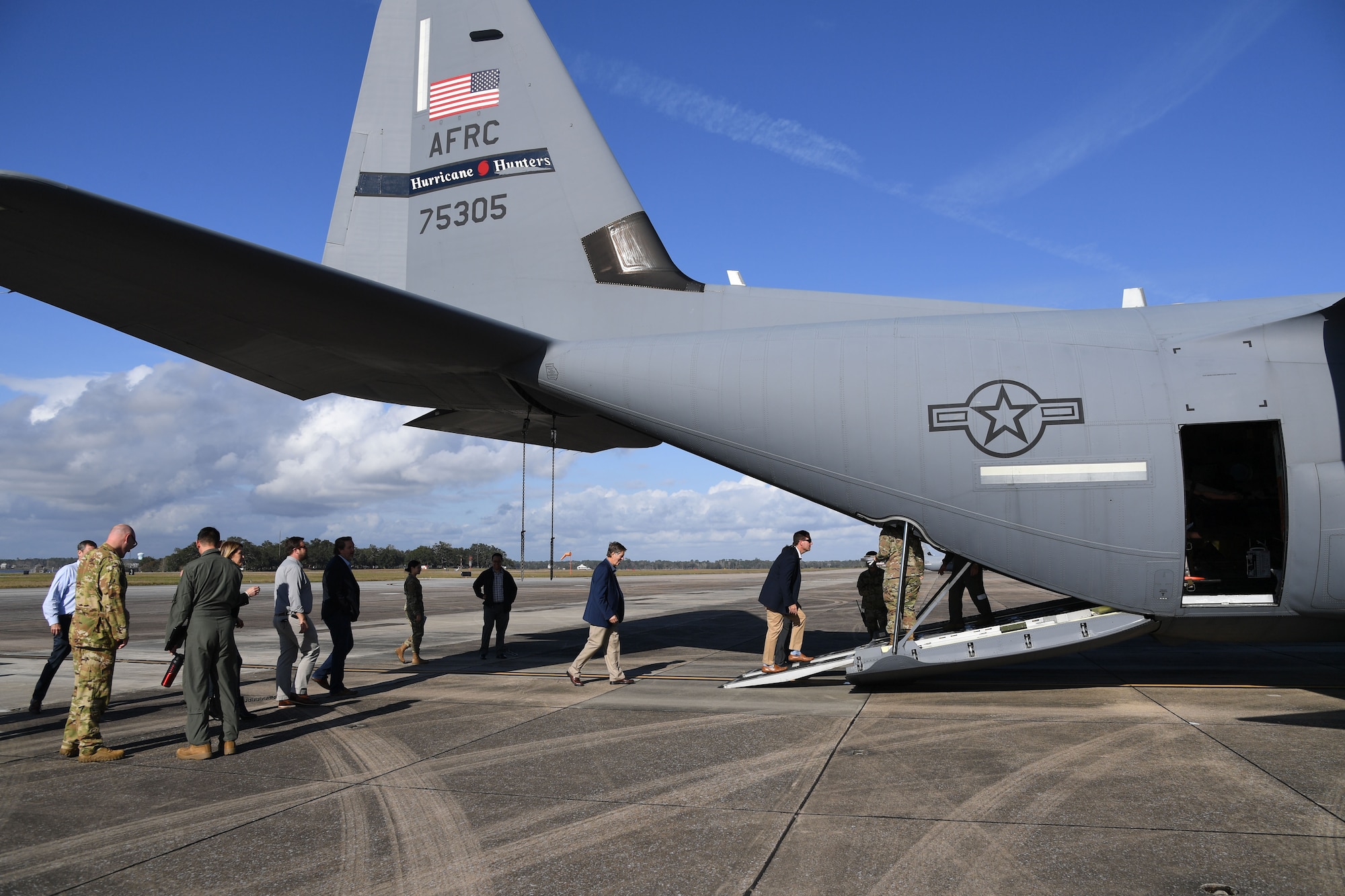 Keesler Civic Leaders walk aboard a WC-130J aircraft for a tour at Keesler Air Force Base, Mississippi, Dec. 16, 2021. 
The 403rd Wing provided an up-close tour of the aircraft to Keesler Civic Leaders to familiarize them with their wing mission. (U.S. Air Force photo by Kemberly Groue)