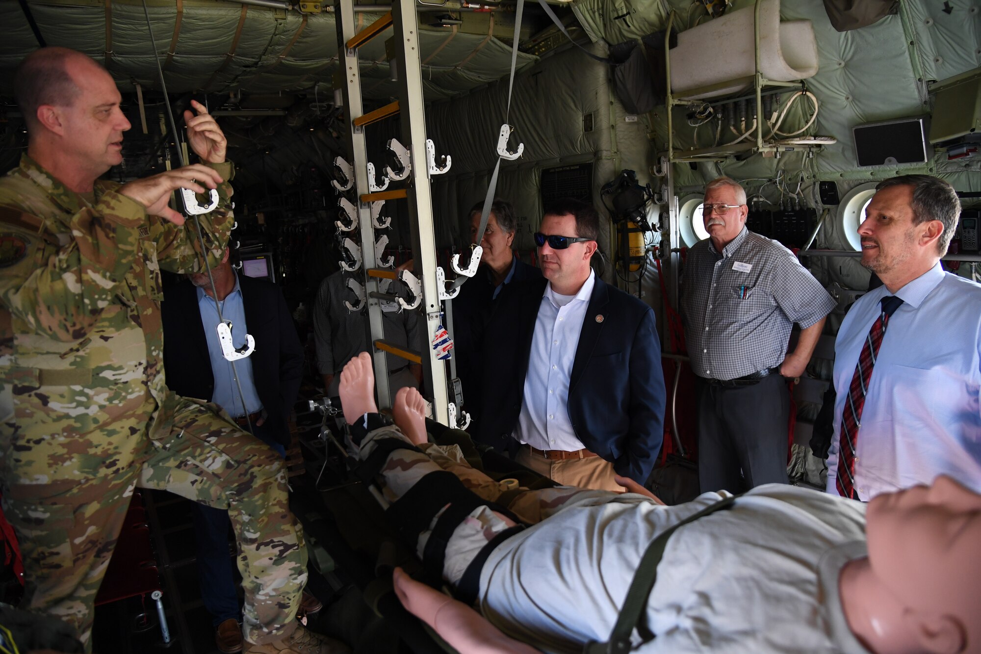 U.S. Air Force Capt. Jonathan Marek, 36th Aeromedical Evacuation Squadron flight nurse, briefs Keesler Civic Leaders on the squadron's capabilities aboard a WC-130J aircraft at Keesler Air Force Base, Mississippi, Dec. 16, 2021.The 403rd Wing provided an up-close tour of the aircraft to Keesler Civic Leaders to familiarize them with their wing mission. (U.S. Air Force photo by Kemberly Groue)