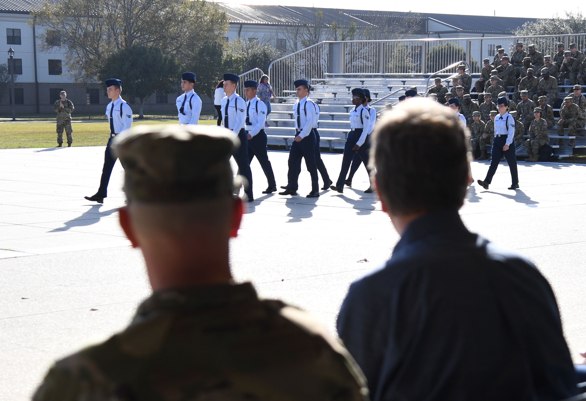 Keesler Civic Leaders attend an 81st Training Group drill team demonstration behind the Levitow Training Support Facility at Keesler Air Force Base, Mississippi, Dec. 16, 2021. The drill down demonstration showcased the camaraderie of the 81st TRG and the importance of partnerships. (U.S. Air Force photo by Kemberly Groue)
