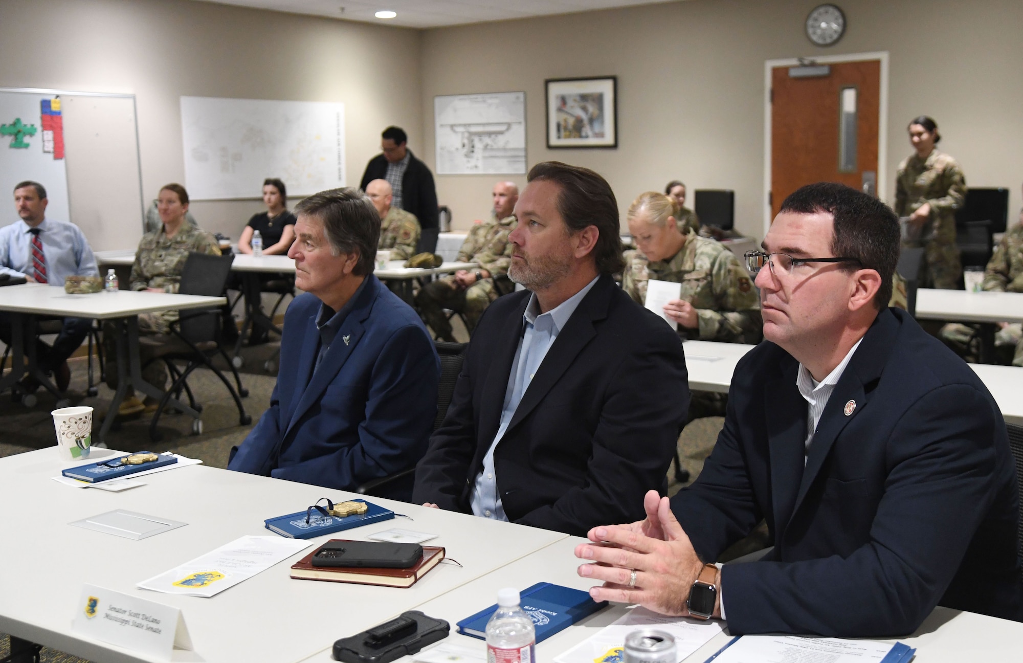 Keesler Civic Leaders attend the 81st Training Wing mission brief inside the fire department at Keesler Air Force Base, Mississippi, Dec. 16, 2021. Keesler Civic Leaders spent an entire day visiting base facilities to familiarize them with the instillation. Strengthening community partnerships is one of the 81st TRW commander's priorities. (U.S. Air Force photo by Kemberly Groue)