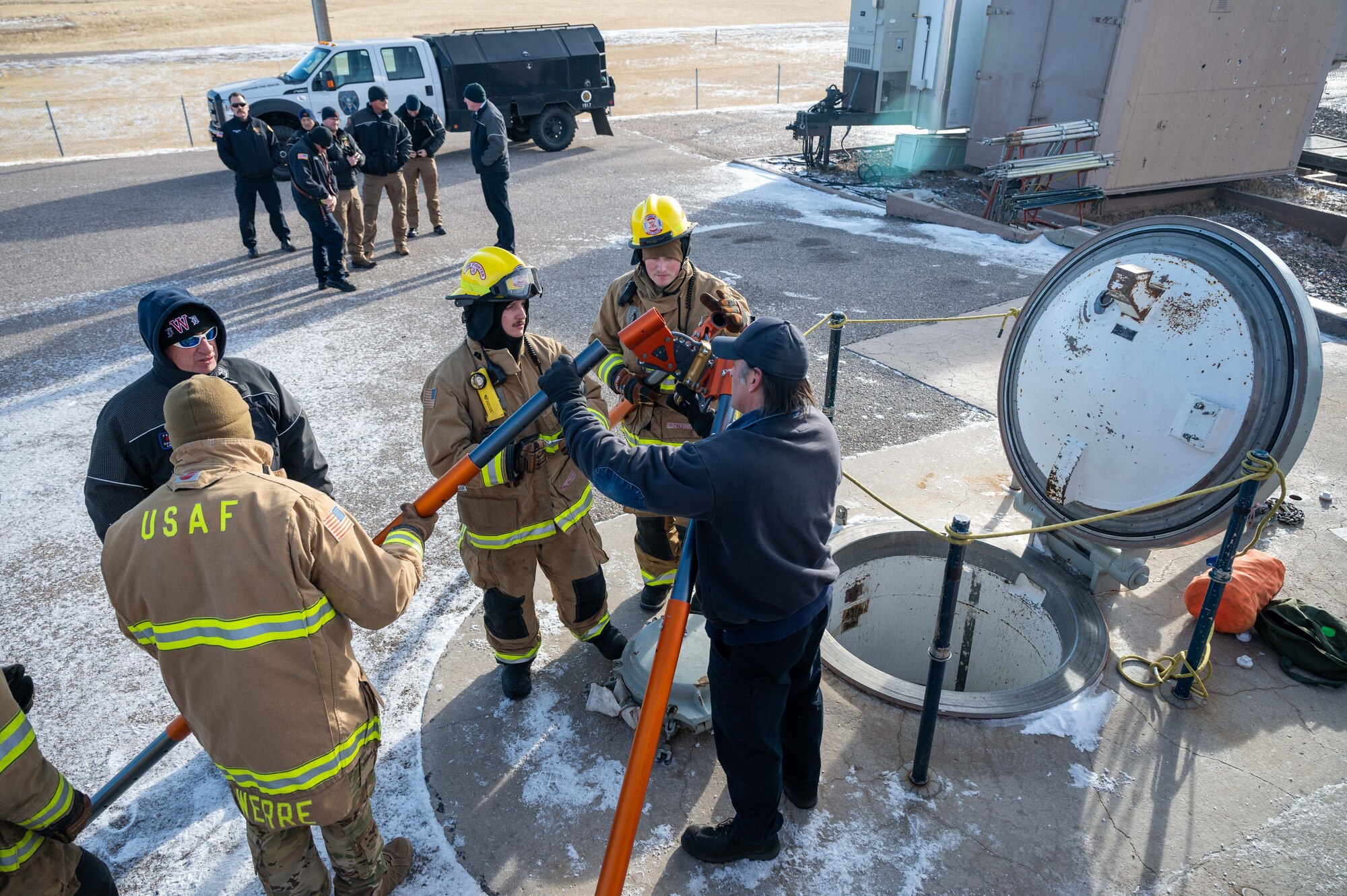 firefighters put together rescue device.