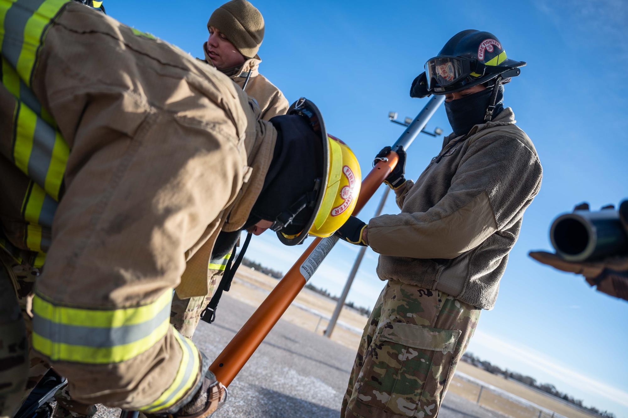 firefighters put together a rescue device