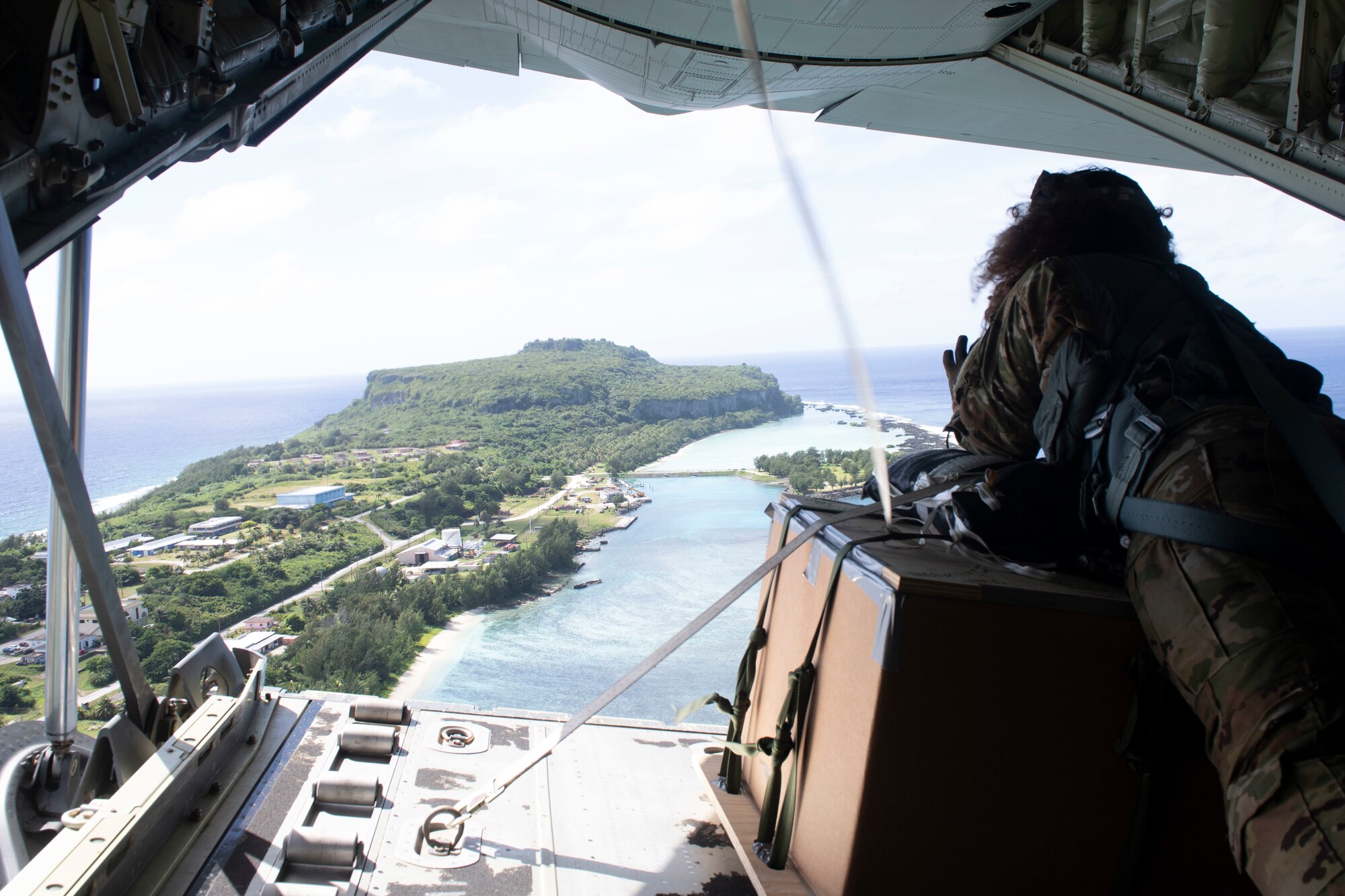 Senior Airman Kim Doyle, 36th Airlift Squadron loadmasters, scout out a drop zone near Orote Dec. 3, 2021, for the 70th Anniversary of Operation Christmas Drop. OCD is the Department of Defense’s longest-running humanitarian assistance and disaster relief training mission and provides relief to more than 55 islands throughout the Pacific. Operations such as OCD provide the U.S. and its partners and allies the opportunity to enhance joint operational capabilities and maintain preparedness for real-world emergencies. (U.S. Air Force photo by Tech. Sgt. Joshua Edwards)