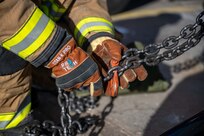 Person pulls down chains
