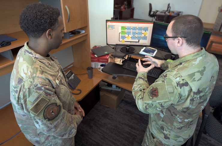 Airmen review a flow chart