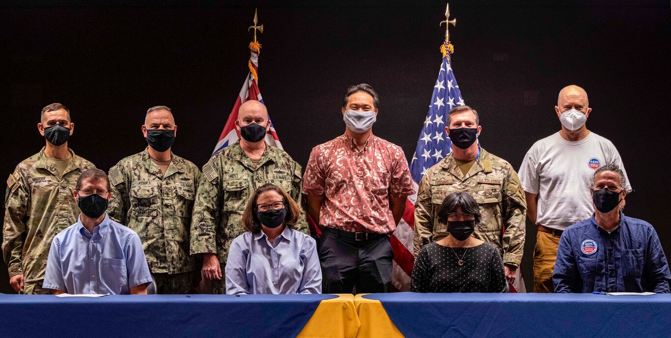 Joint Service and civilian senior leaders from Joint Base Pearl Harbor-Hickam (JBPHH), stand together in partnership after a Joint Water Distribution System Recovery Plan Agreement signing ceremony Dec. 17, 2021 at U.S. Pacific Fleet Headquarters