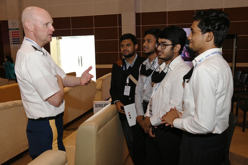 U.S. Army Lt. Col. Chris Herion takes with student volunteers at the conclusion of the Bangladesh Disaster Response Exercise and Exchange (DREE) 2021 hosted by The Bangladesh Ministry of Disaster Management and Relief (MoDMR), Bangladesh Armed Forces Division (AFD), and the United States Army Pacific (USARPAC), at Dhaka, Bangladesh on Oct. 28, 2021. The DREE brings together over 30 countries working in partnership (or collaboration) with government and non-government organizations to compare best practices for disaster relief, culminating in a table-top exercise to simulate a large-scale earthquake response.