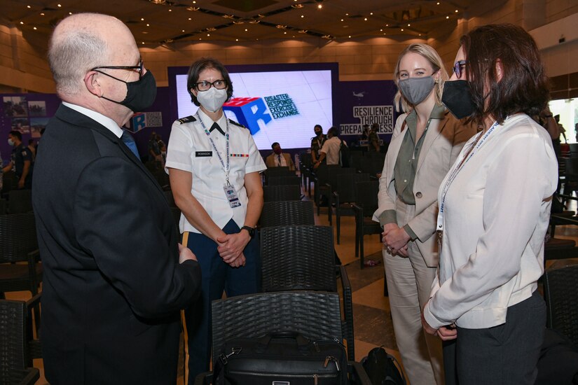 Ms. Stephanie Meyer from the Institute for Security Governance (right) along with Ms. Emily Macdonald (center right), Capt. Sarah Robinson (center left) meet with a representative from the High Commission of Australia (left) attending the closing ceremony the Bangladesh Disaster Response Exercise and Exchange (DREE) 2021 hosted by The Bangladesh Ministry of Disaster Management and Relief (MoDMR), Bangladesh Armed Forces Division (AFD), and the United States Army Pacific (USARPAC), at Dhaka, Bangladesh on Oct. 28, 2021. The DREE brings together over 30 countries working in partnership (or collaboration) with government and non-government organizations to compare best practices for disaster relief, culminating in a table-top exercise to simulate a large-scale earthquake response.