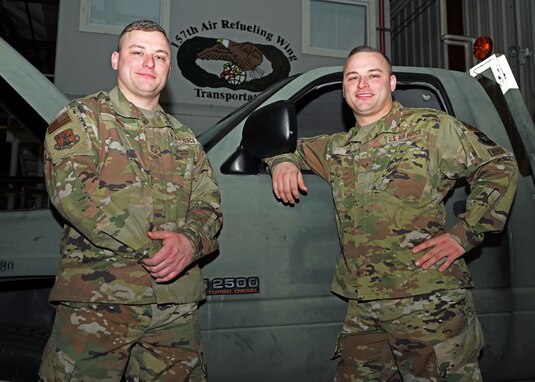 From left, Tech. Sgt. Sean Wood and Staff Sgt. Christopher Wood, vehicle maintainers with the 157th Air Refueling Wing, pose in their flight maintenance facility Dec. 15, 2021, at Pease Air National Guard Base. The fraternal twin brothers have served side by side in the New Hampshire Air National Guard since going through basic training together 13 years ago. (U.S. Air National Guard photo by Tech. Sgt. Charles Johnston)