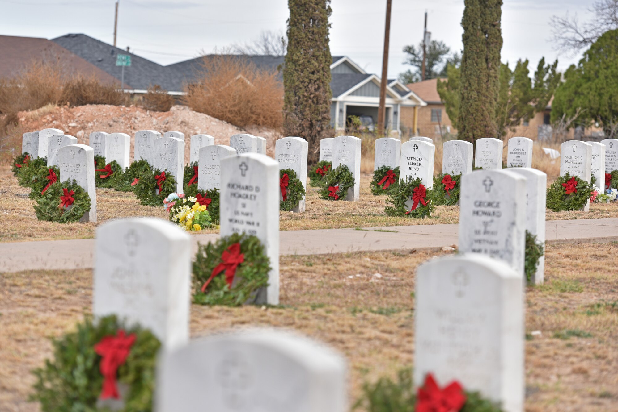 Graves are adorned with wreaths during the Wreaths Across America ceremony at Belvedere Memorial Park Cemetery in San Angelo, Texas, Dec. 18, 2021. Wreaths Across America’s mission is to remember, honor and teach by coordinating wreath-laying ceremonies at Arlington National Cemetery as well as more than 1,600 additional locations in all 50 states, at sea and abroad. (U.S. Air Force photo by Senior Airman Ashley Thrash)