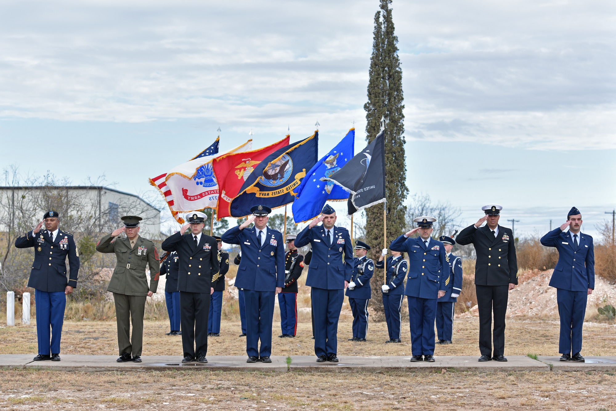 Leaders from different service branches salute during the Wreaths Across America ceremony at Belvedere Memorial Park Cemetery in San Angelo, Texas, Dec. 18, 2021. Goodfellow Air Force Base service leaders laid special wreaths to honor prisoners of war, those missing in action, veterans and active duty members . (U.S. Air Force photo by Senior Airman Ashley Thrash)