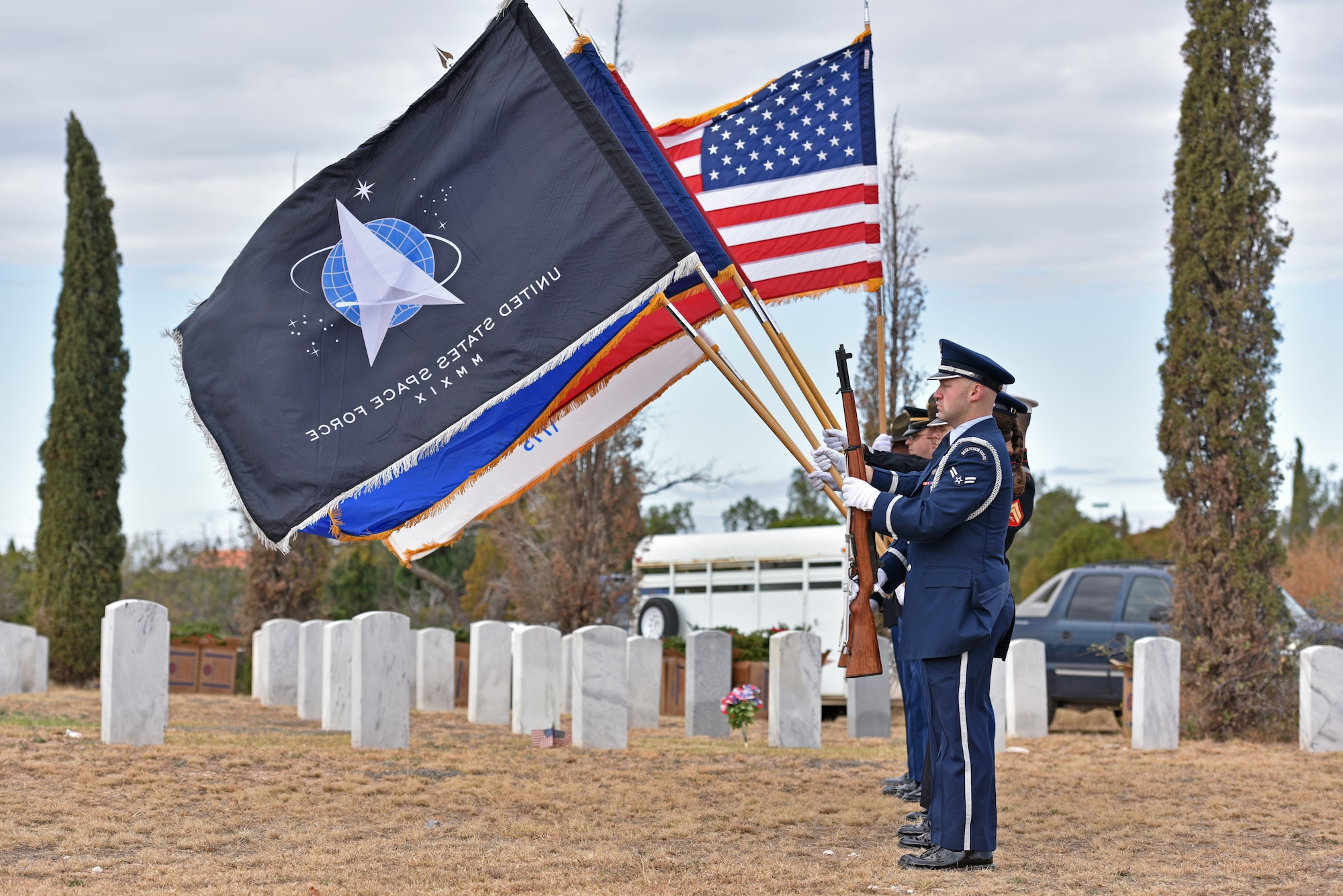 The Goodfellow Joint Service Color Guard presents the colors during the Wreaths Across America ceremony at Belvedere Memorial Park Cemetery in San Angelo, Texas, Dec. 18, 2021. Members from Goodfellow Air Force Base and the San Angelo community joined together to honor veterans. (U.S. Air Force photo by Senior Airman Ashley Thrash)