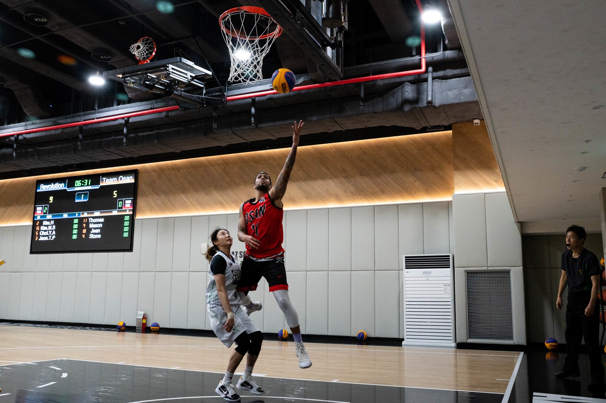 SSgt Terrance Thomas, 731 Air Mobility Squadron, passenger terminal personelist, scores a layup during Haetaewarning3 basketball game at AZ Seoul Arena