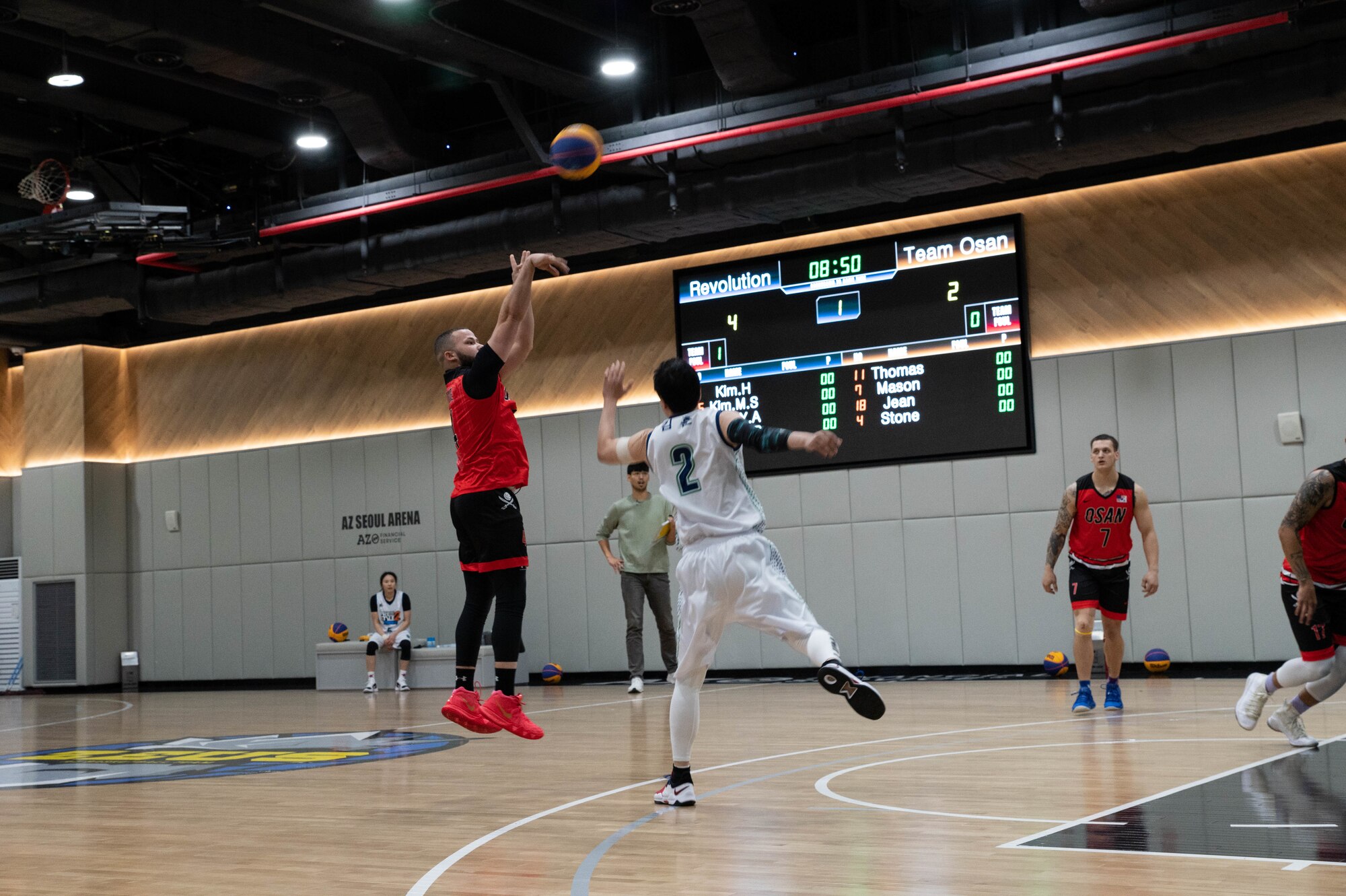 Senior Airman Micah Stone, 51st Civil Engineering Squadron heating ventilation and air conditioning (HVAC) technician, shoots the ball during Haetaewarning3 basketball game at AZ Seoul Arena