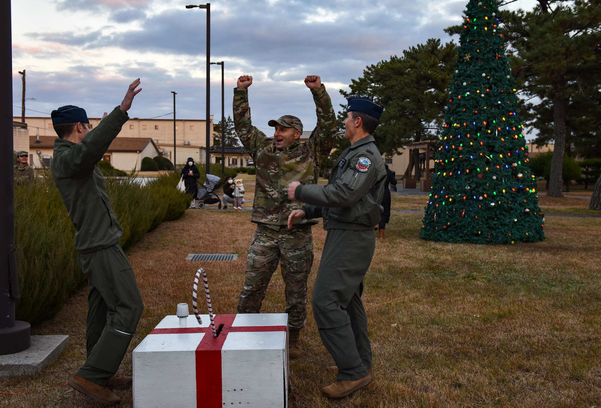 Commanders cheer during a tree lighting.