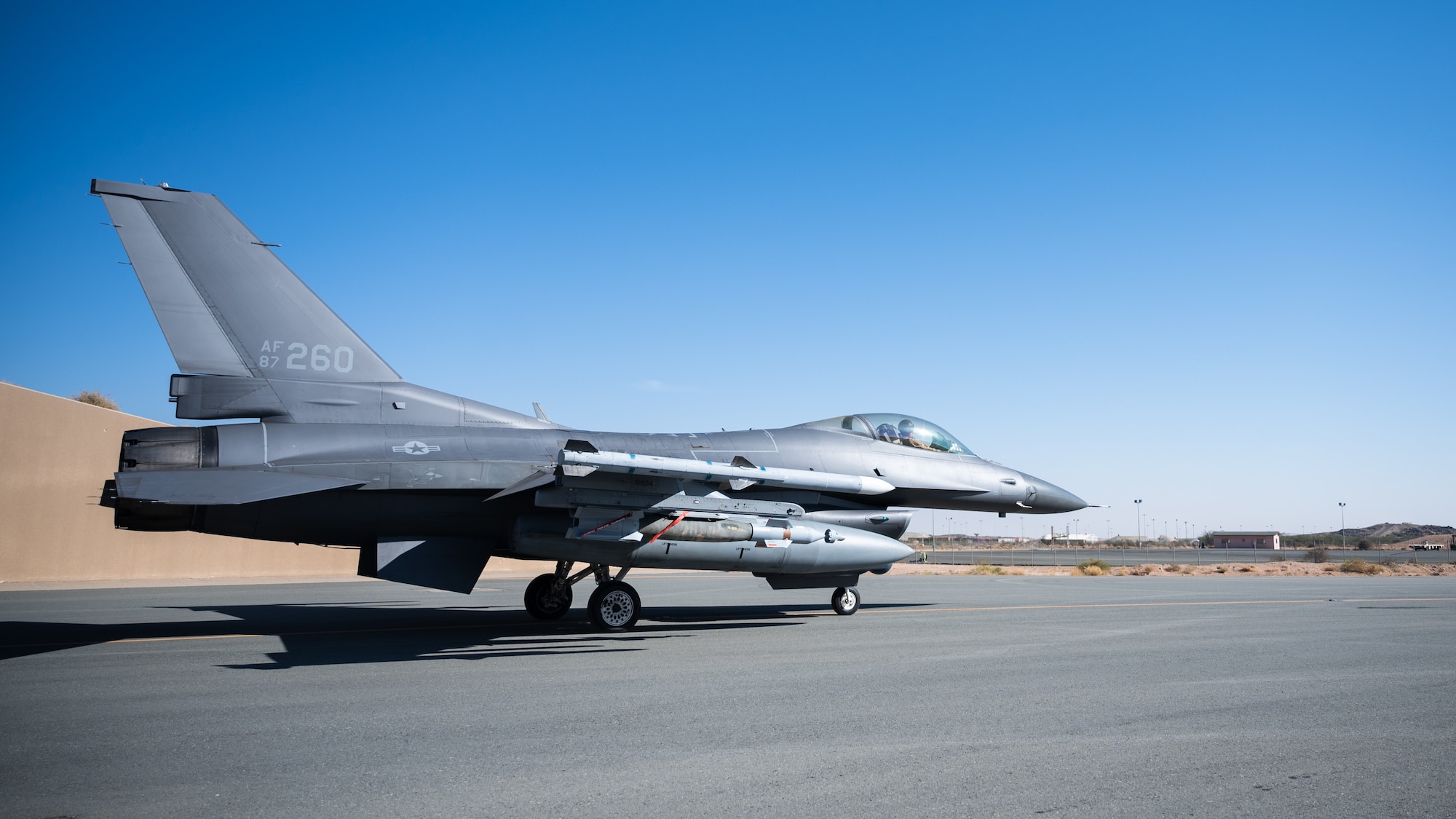 An F-16 Fighting Falcon taxis to the to the runway at King Fahad Air Base, Kingdom of Saudi Arabia, Dec. 7, 2021. U.S. F-16s integrated with Royal Saudi Air Force F-15s to strengthen and reinforce air defenses against any potential threats. (U.S. Air Force photo by Senior Airman Jacob B. Wrightsman)