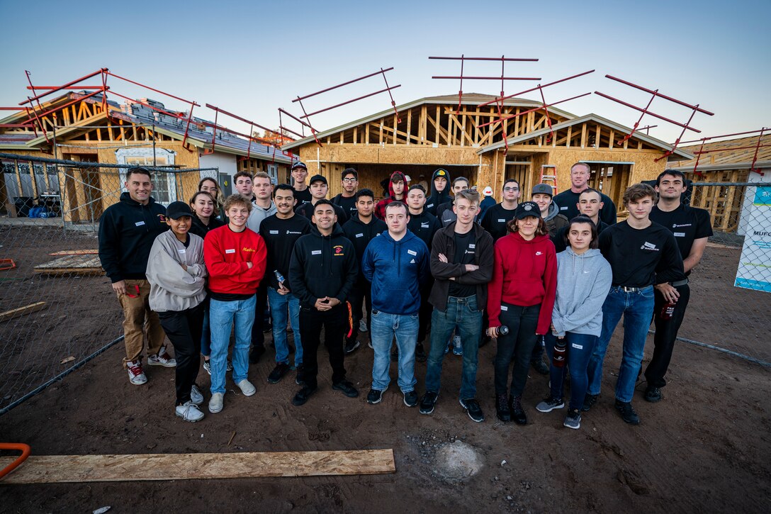 U.S. Marines and poolees from Recruiting Substation Arrowhead volunteer to build two homes on Dec. 11, 2021 in Phoenix, Arizona. The Marines and poolees assisted Habitat for Humanity to help out those less fortunate in the local community before the Holidays. (U.S. Marine Corps photo by Cpl. Brennan J. Beauton)