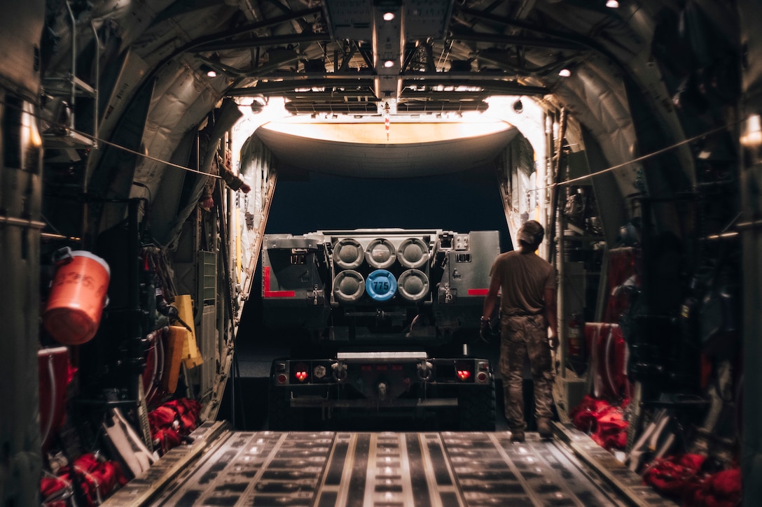 Marine Corps High Mobility Artillery Rocket System attached to Bravo Battery, Battalion Landing Team, 1/1, 11th Marine Expeditionary Unit (MEU), drives out of an Air Force C-130J Super Hercules attached to the 61st Expeditionary Airlift Squadron during a fires interoperability exercise at Camp Buehring, Kuwait, Nov. 7. The 11th MEU is deployed to the U.S. 5th Fleet area of operations in support of naval operations to ensure maritime stability and security in the Central Region, connecting the Mediterranean and Pacific through the Western Indian Ocean and three strategic choke points. (U.S. Marine Corps photo by Staff Sgt. Donald Holbert/Released)