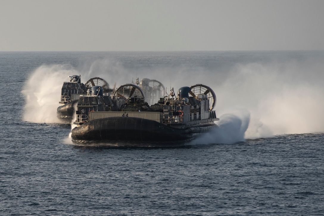 Landing Craft, Air Cushion 44,  assigned to Assault Craft Unit 5, conducts a sustainment training flight, Nov. 28. The USS Portland (LPD 27) and the 11th Marine Expeditionary Unit are deployed to the U.S. 5th Fleet area of operations in support of naval operations to ensure maritime stability and security in the Central Region, connecting the Mediterranean and Pacific through the Western Indian Ocean and three strategic choke points. (U.S. Marine Corps photo by Lance Cpl. Patrick Katz)